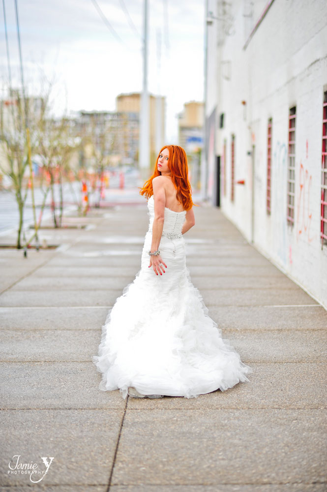 las vegas trash the dress photography with bride walking down street bright orange hair