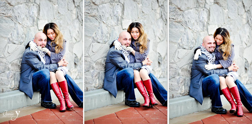 Cute couple's engagement photography session in downtown las vegas with them sitting on a curb and smiling