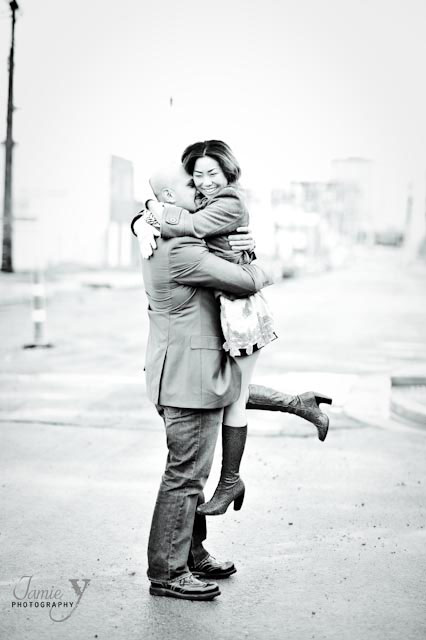 Las Vegas engagement photography session of man and woman downtown with him lifting her up