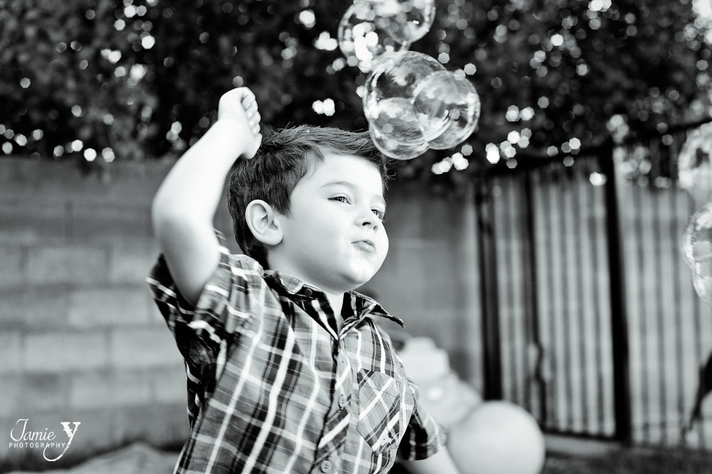 las vegas children's photography session in backyard with bubbles