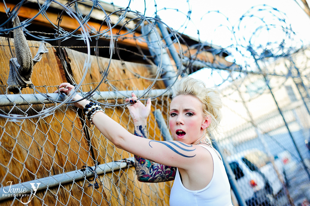 tattooed bride touching barbed wire in las vegas