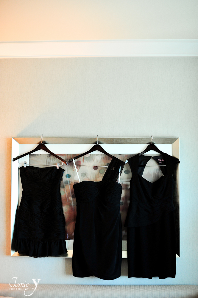bridesmaid dresses in black hanging in room