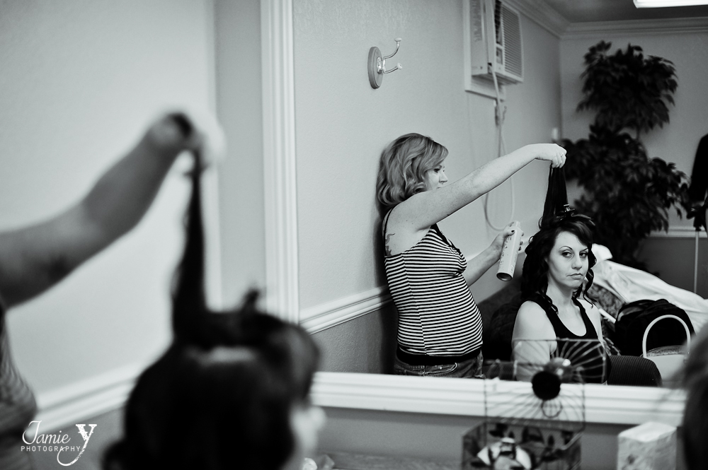 bride getting ready in room at the grove in las vegas