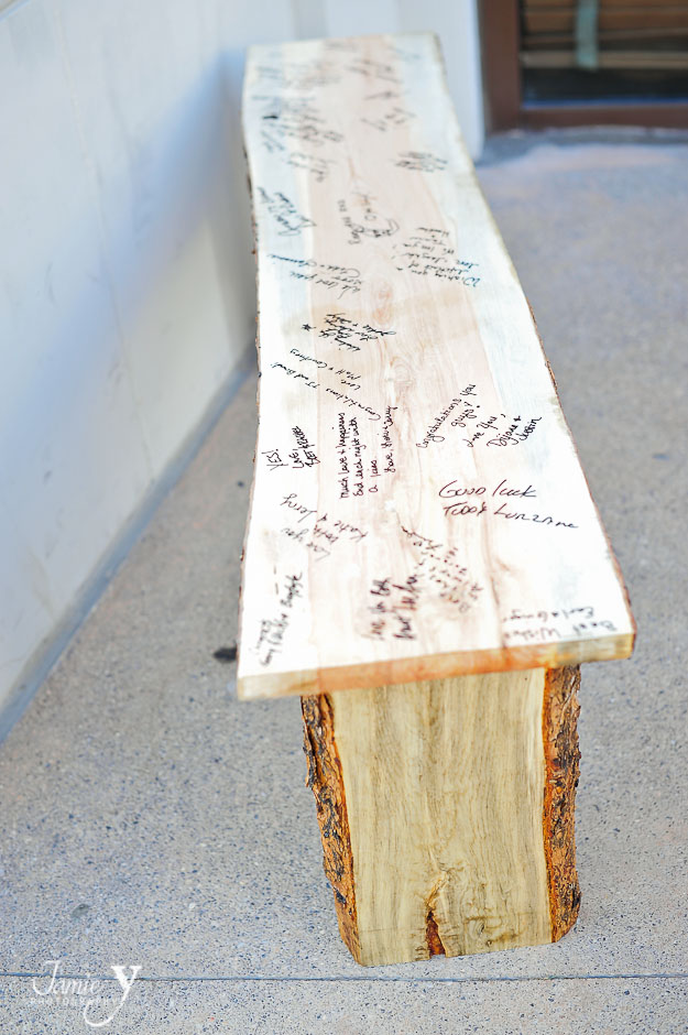 unique wedding sign in wooden bench