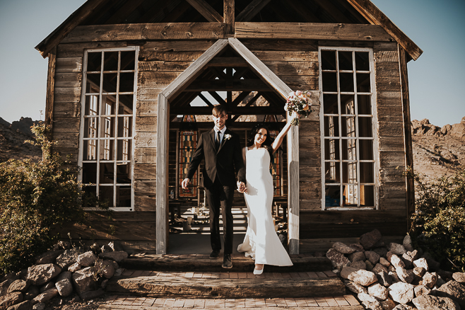 bride and groom walking out of chapel at nelson nevada