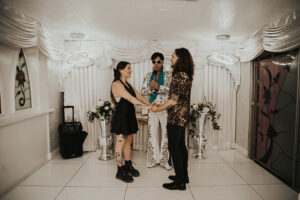 couple being married by elvis at little white chapel