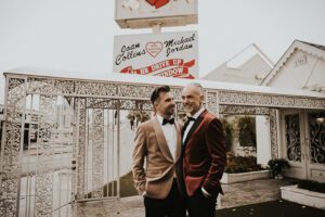two grooms after wedding outside of little white chapel las vegas