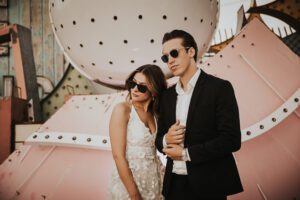 bride and groom in front of neon sign at the neon museum in downtown las vegas