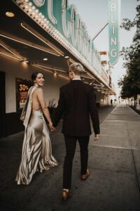 bride and groom walking downtown las vegas