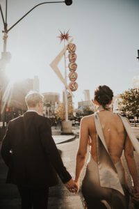 bride and groom walking downtown las vegas