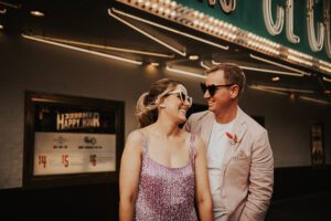 bride and groom in front of el cortez in downtown las vegas