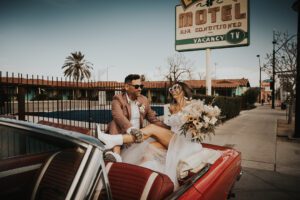 rock n roll bride and groom in vintage car