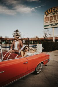 rock n roll bride and groom in vintage car