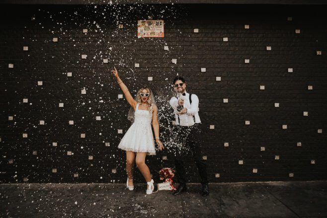 las vegas wedding couple in spring with champagne