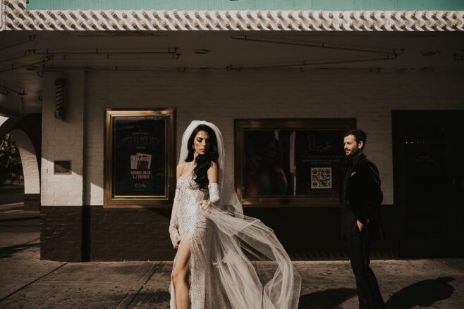 dramatic editorial style photo of bride and groom in las vegas in downtown area
